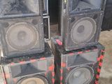three speakers are stacked on top of each other outside