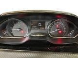 a close up of a car dashboard with various gauges