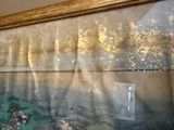 a picture of a painting on the wall of a room