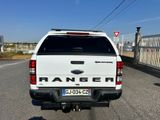 a white truck that is parked on the side of the road