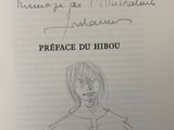 drawing of a child ' s face and handwritten text on a piece of paper