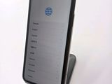 an image of a cell phone sitting on top of a stand