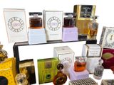 many different types of perfumes displayed on a shelf