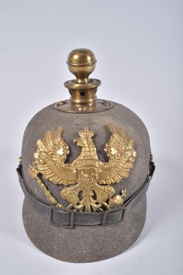 an old military hat with a gold eagle on it