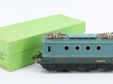 a toy train that is sitting next to a green box
