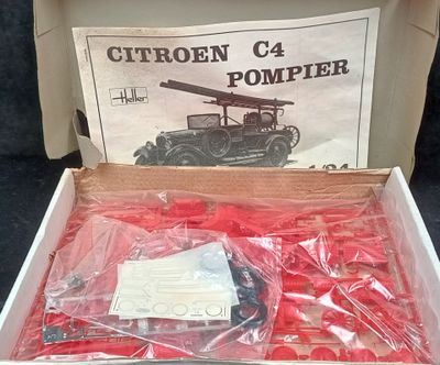 a box that has a bunch of red plastic items in it