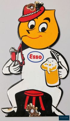 a picture of a sign that says esso with a man holding a glass of beer
