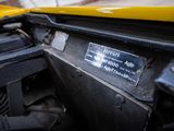 a close up view of the engine compartment of a yellow truck