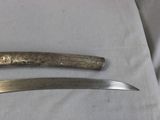 a knife and a knife blade on a table