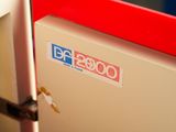a close up of a red and white box with a sticker on it