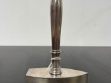 a close up of a metal object on a table