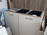 a white refrigerator and a white dishwasher in a room
