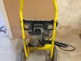a small yellow machine that is sitting on the floor