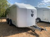 a trailer that is parked in the grass