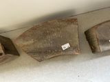 three pieces of wood sitting on the floor next to each other