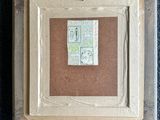 a picture of a picture in a box on the floor