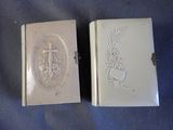 pair of antique silver plated book cases with a cross and flowers