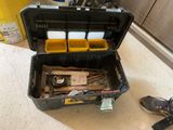 a black tool box with tools in it on the floor