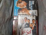 a plastic bag full of movies and dvds in it