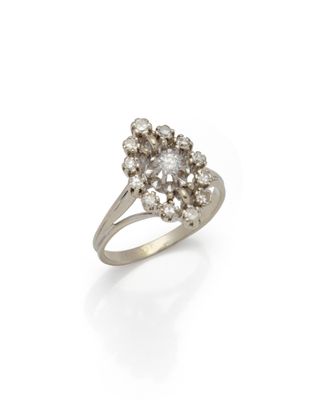 a diamond cluster ring, by van cleef