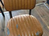 a lot of chairs that are sitting in a room
