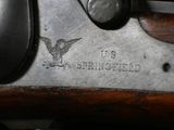 an image of a close up of a rifle with a us air force emblem on it