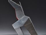 a sculpture of a horse that is sitting on top of a table