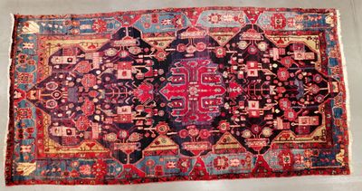 an old persian rug is displayed on a white surface