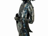 an image of a statue of a woman holding a flower