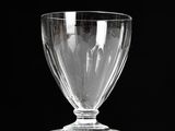 a clear glass cup sitting on top of a table