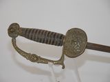 a close up of a sword with a metal handle