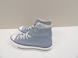 blue converse high top sneakers with white laces on a white surface