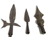 three different types of weapons are displayed on a white surface