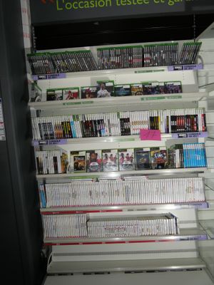 a lot of video games on the shelves in the store