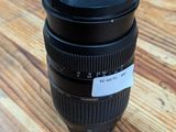 a close up of a camera lens sitting on a wooden table