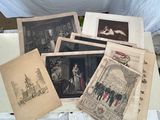 a lot of old photographs on a table