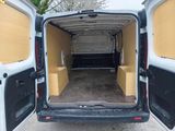 a white van with its doors open in a parking lot