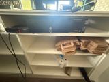 a tv that is sitting on a shelf in a room