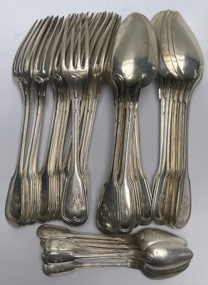 a lot of silver spoons and spoons on the table