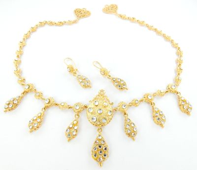 a gold necklace and earring set
