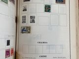 an open book with stamps on it on a table
