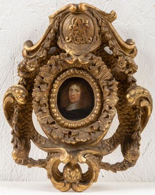 a gold clock with a picture of a man on it