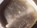 a close up of a silver plate with writing on it