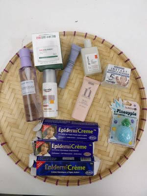 a wicker tray with various skin care products on it