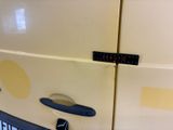 a close up of a car door with a sticker on it