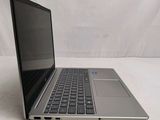 a laptop that is sitting on a white surface