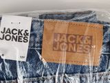 the back of a pair of jack and jones jeans wrapped in plastic