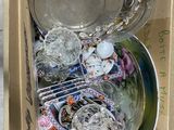 a cardboard box filled with many different types of dishes