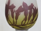 a wine glass that has a picture of flowers on it