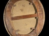 a round wooden object with a hole in the middle